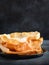 Indian snacks. Close up of rustic indian papadum crisp on a dark background, copy space. Selective focus