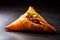 Indian snacks vegetable Samosas a spicy blend of vegetables wrapped in a deep fried triangular pastry parcel, fried