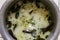 Indian special food water rice close view garnishes with peppermint leafs &  ginger & oil fried by curry leafs, red chills, cumin,