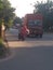 Indian street aur aur road with a truck vehicles.