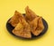 Indian Street Food Samosa or Samosas is a Crispy And Spicy Triangle Shape Snack