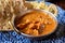 Indian style food, chiken tikka masala curry dish served with rice and garlic bread naan