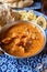 Indian style food, chiken tikka masala curry dish served with rice and garlic bread naan