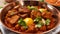 Indian style meat dish in a copper bowl