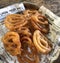 Indian Sweet Jalebi or imarti on paper. Jalebi is one of the most delicious sweets widely used in India