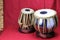 Indian tabla drums on a red background