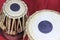 Indian tabla drums on a red background