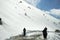 Indian and tibetan people work clearing snow covered out of road for protect car slip at  Khardung La Road at Leh Ladakh in India