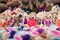 Indian traditional handmade puppet dolls made of jute isolated on blurred background is displayed in a street shop for sale.