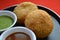 Indian traditional kachori with chutneys.