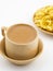 Indian Traditional Masala Chai or Masala Tea Served With Besan Papri on White Background