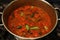 Indian traditional mixed vegetable curry with lentils known as sambar in a cooking pot