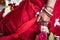 Indian traditional wedding. authentic Vedic wedding ritual called vivaha Yajna. Red Sari, women hands with mehendi close