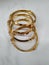 Indian Traditional Women Wear Gold Bangles or Bracelets  on white background