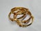Indian Traditional Women Wear Gold Bangles or Bracelets  on white background