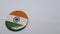 Indian Tricolor placed over a circular object kept isolated on a white