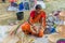 An Indian Unidentified woman preparing bamboo carving artwork of bamboo sticks items for sale in Kolkata in handicrafts trade fair