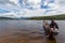 Indian Venezuelan guide resting on canoe, Canaima, Venezuela