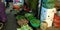 an indian village farmer woman selling greengrocery on road