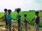 indian village little childrens plying with toy car green field at village area in India January 1, 2020