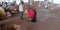 An indian village woman cleaning floor at agricultural produce market