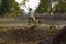 Indian villager going for collecting water from pond on bicycle on summer days