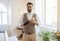 Indian Waiter Guy With Bottle Of Wine Standing At Hotel