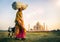 Indian Woman Carrying on Head Goat Taj Mahal Concept