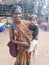 Indian woman with child on Wednesday Market in Anjuna, Goa, India.