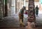 An Indian woman cleaning a temple