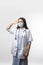 Indian Woman doctor in uniform and face mask saluting with copyspace