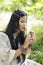 Indian woman in ethnic clothes touches a snail