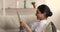 Indian woman holding tablet device make video conference call