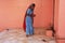 Indian woman offering food for rats, Karni Mata Temple, Deshnok, India