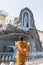 Indian woman praying in front of a Maria statue next to the Immaculate Conception Cathedral in Pondicherry