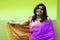 Indian Woman in Purple Saree standing and smiling