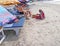 Indian woman selling coconuts on beach, GOA