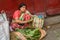 Indian woman selling green beetle leaves on the street in Kolkata. India