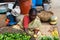 Indian Woman selling produce at the market