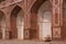 Indian woman sitting outside Humayun\'s Tomb, Delhi, India