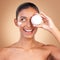 Indian woman, skincare cream and jar in studio with smile, happiness and wellness by brown background. Happy model