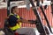 Indian woman staff worker work forklift driver at port cargo warehouse container yard for logistics industry happy smile