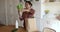 Indian woman unpack fresh natural groceries from paper shopping bag