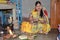 Indian women offering her prayers with fruits and bundle of bananas during the festival of Chhath Puja.