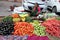 Indian women sell fruit and vegetables by the side of the road in Jaipur