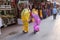 Indian women with traditional colored sari on the street of Pushkar