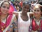 Indian women in traditional dress with African woman.