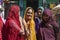 Indian women traditionally dressed shopping at vegetable market