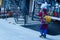 Indian Women walking on street.lifting heavy electric cable roll on her head