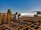 an indian worker making iron structure during railway bridge construction on site in India January 2020